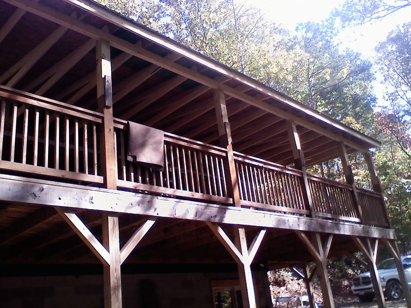 Timber framing under a new elevated porch and deck — Roof Leak Repair in Pinckney by Roofing Brothers